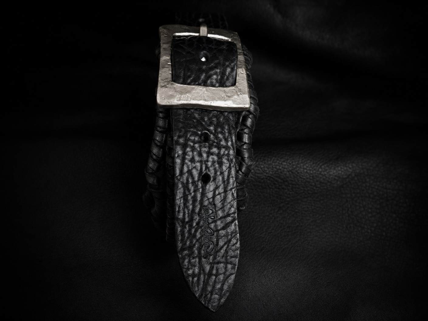 HINAWA handmade black leather guitar strap end detail, genuine cowhide from Japan