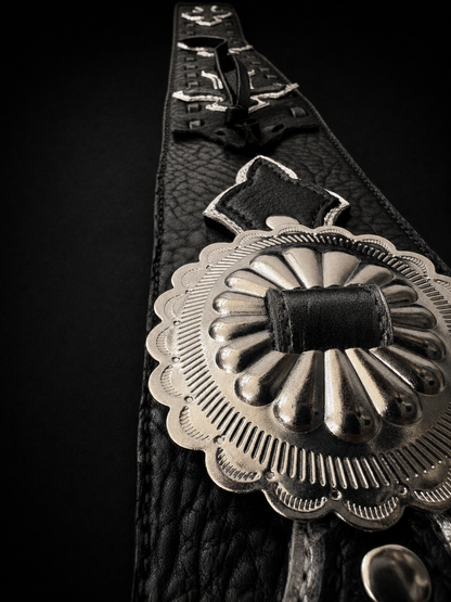 Concho detail on ANJIN TsukasaJames handmade leather guitar strap