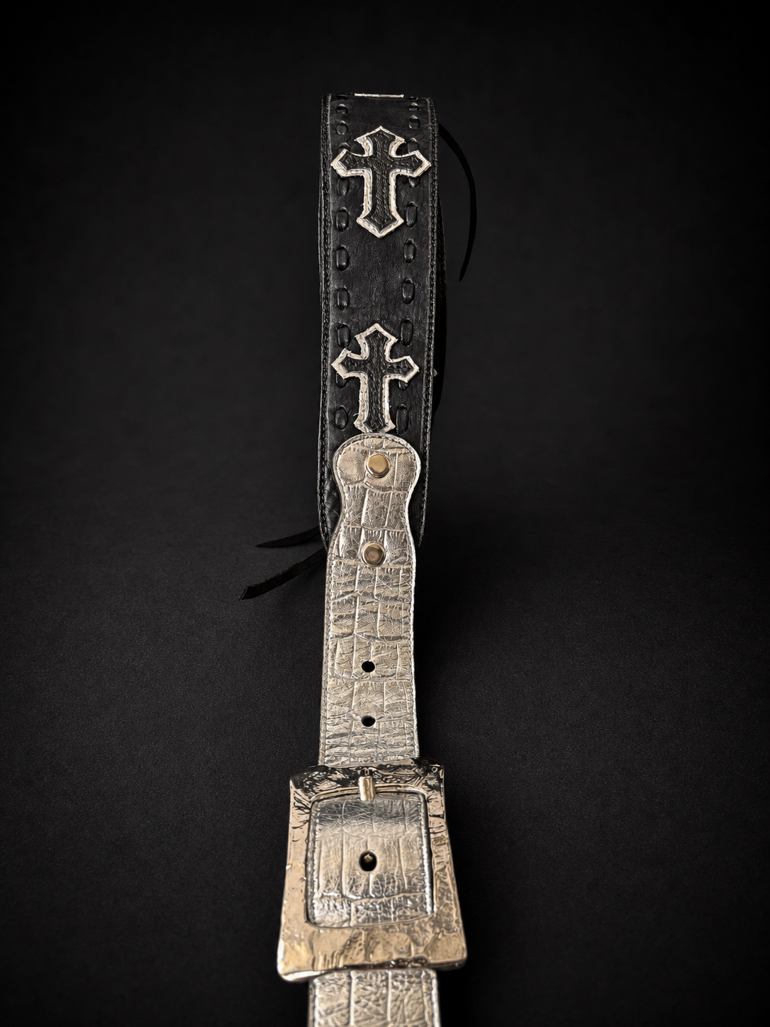 Cross concho appliqué detail on ANJIN black leather guitar strap from Japan