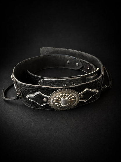 Side view of ANJIN black leather guitar strap showing width and stitching