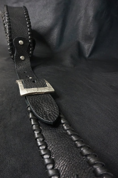 Whipstitching detail on ASHIGARU handmade black leather guitar strap from Japan