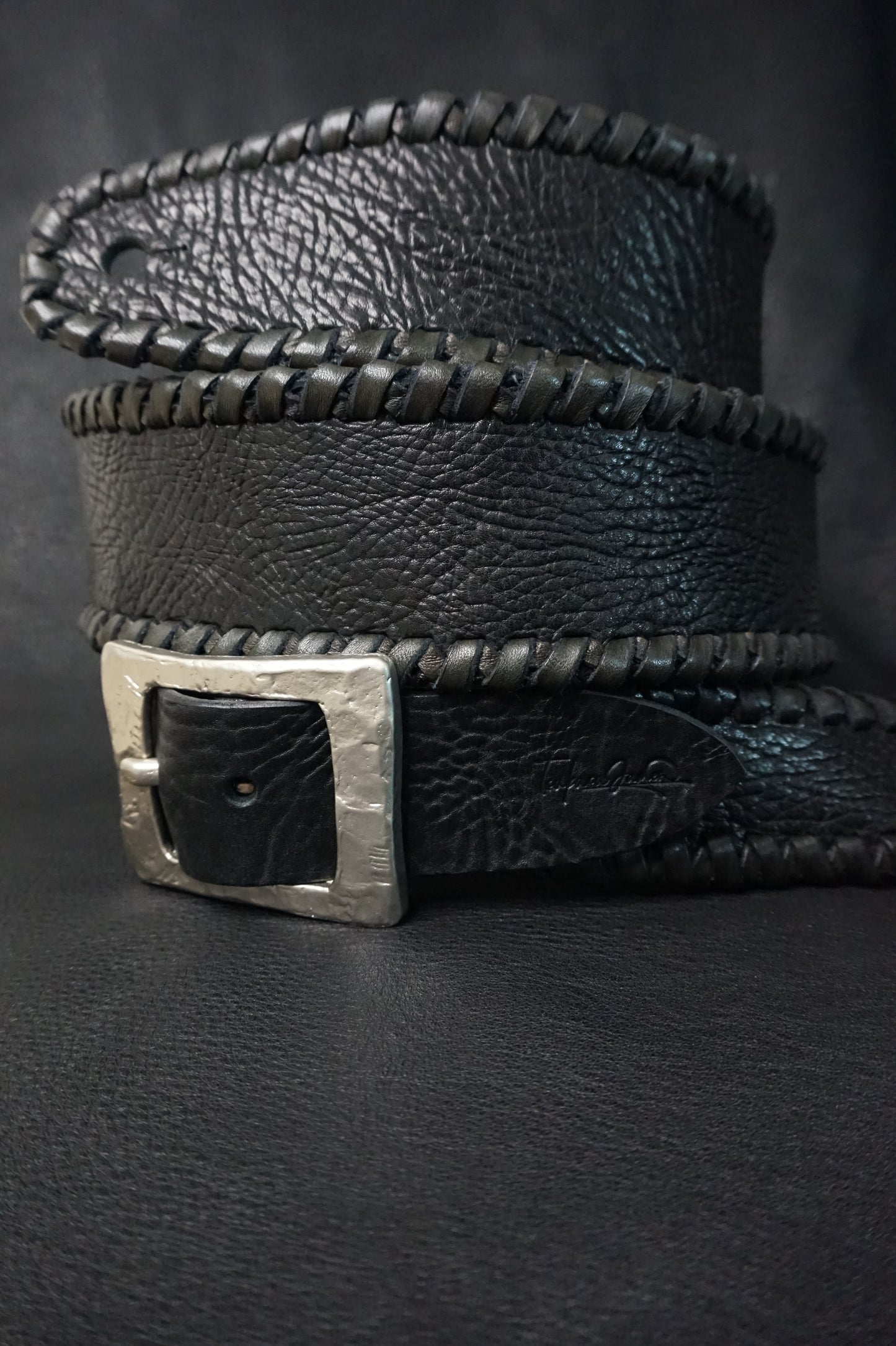 Buckle detail on ASHIGARU handmade leather guitar strap, nickel hardware