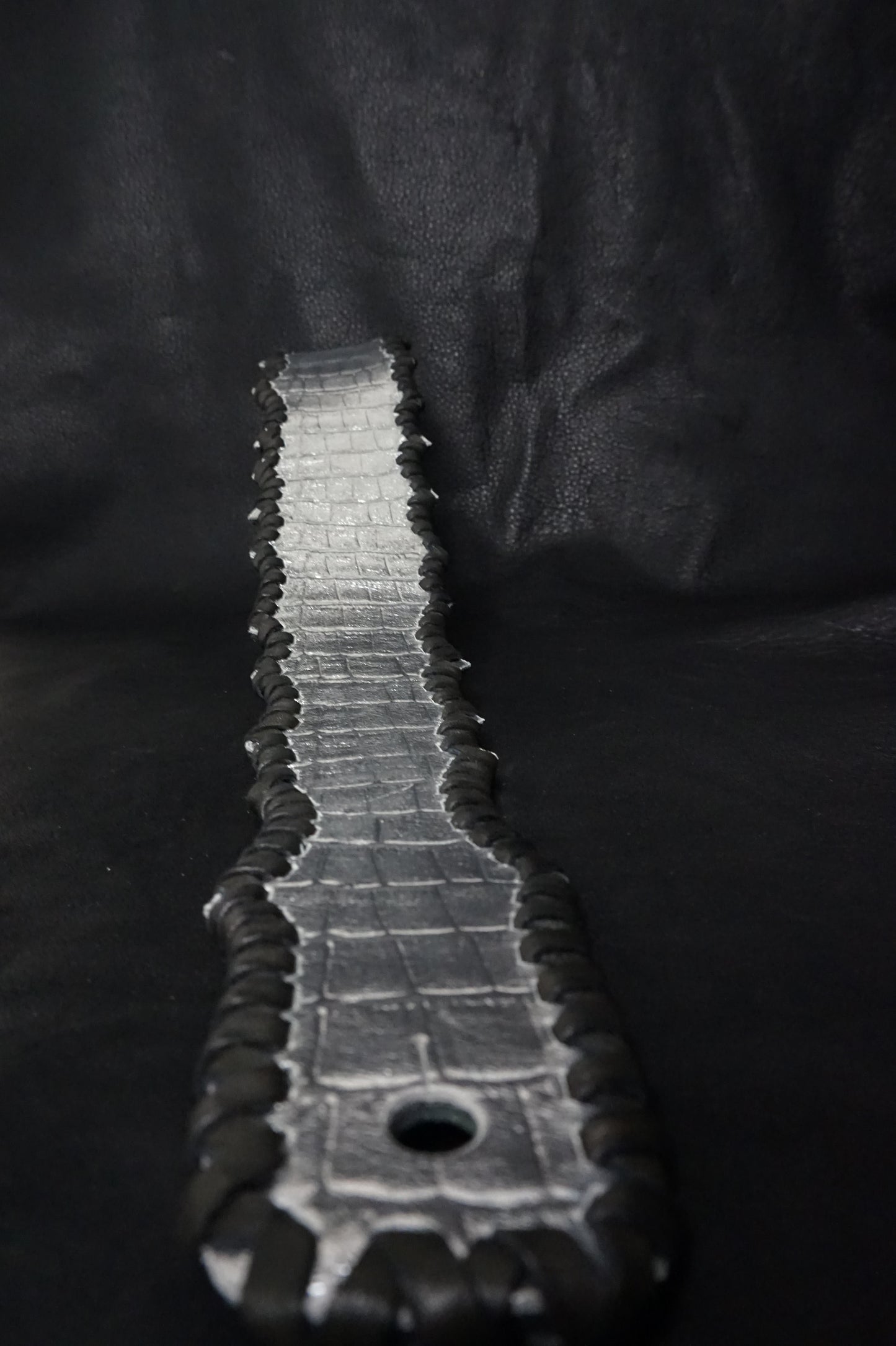 Side view of HAKU-RYU silver leather guitar strap showing width and texture