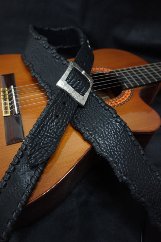 HINAWA "火縄" handmade leather guitar strap worn on acoustic guitar, black cowhide from Japan