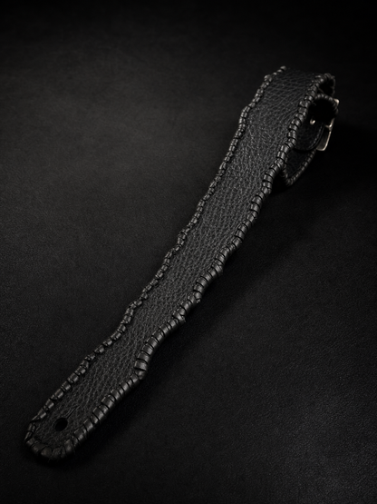 Close-up of black shrink leather texture on HINAWA TsukasaJames guitar strap