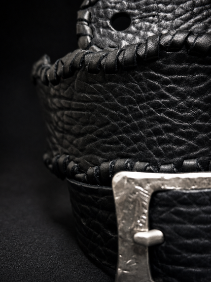 Side view of HINAWA black leather guitar strap showing 8cm width