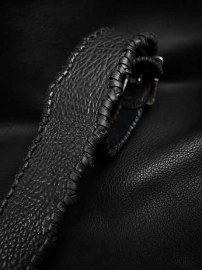 Edge detail of HINAWA handmade cowhide leather guitar strap from Japan