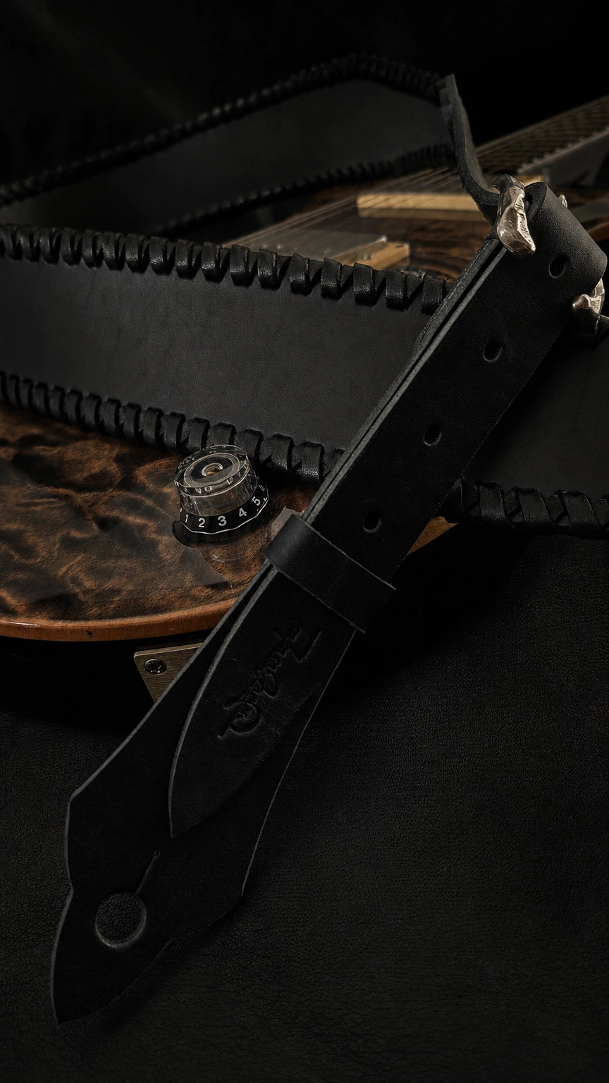 Close-up of NINJA WIDE black leather guitar strap end and adjustment holes, TsukasaJames