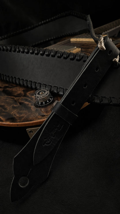 Close-up of NINJA WIDE black leather guitar strap end and adjustment holes, TsukasaJames