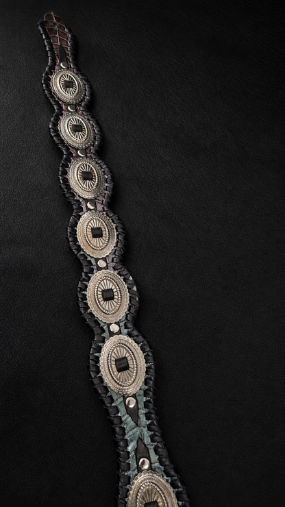 Concho row detail on RAIDEN croc-embossed leather guitar strap